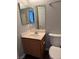 A bathroom showcasing a vanity with a sink, wood-look cabinet, and a large mirror at 9303 Gilcrease Ave # 1097, Las Vegas, NV 89149