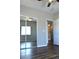 An inviting bedroom highlighting mirrored closet doors, wood-look flooring, and a ceiling fan at 9303 Gilcrease Ave # 1097, Las Vegas, NV 89149