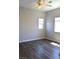 Spacious bedroom features wood-look floors, a ceiling fan, and lots of natural light at 9303 Gilcrease Ave # 1097, Las Vegas, NV 89149