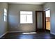Bedroom featuring durable wood-look floors, natural light, and a sliding door at 9303 Gilcrease Ave # 1097, Las Vegas, NV 89149