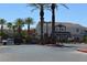 Gated community entrance with lush palm trees at 9303 Gilcrease Ave # 1097, Las Vegas, NV 89149