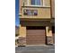 Garage door of property with stone accents beneath address sign 1097-1099 and 1098 at 9303 Gilcrease Ave # 1097, Las Vegas, NV 89149