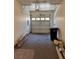 The garage showcasing an open garage door and items stored on the garage floor at 9303 Gilcrease Ave # 1097, Las Vegas, NV 89149