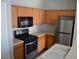 Bright kitchen featuring stainless steel appliances, light wood cabinets, and laminate countertops at 9303 Gilcrease Ave # 1097, Las Vegas, NV 89149