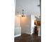Charming space with modern light fixture and a view of the kitchen at 9303 Gilcrease Ave # 1097, Las Vegas, NV 89149
