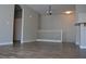 Open-concept living space with modern flooring and staircase access at 9303 Gilcrease Ave # 1097, Las Vegas, NV 89149