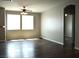 Spacious living room featuring wood-look floors and ample natural light at 9303 Gilcrease Ave # 1097, Las Vegas, NV 89149