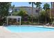 Inviting swimming pool with lounge chairs and shade structures, perfect for relaxation at 9303 Gilcrease Ave # 1097, Las Vegas, NV 89149