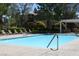 Inviting swimming pool with lounge chairs and shade structures, ideal for outdoor enjoyment at 9303 Gilcrease Ave # 1097, Las Vegas, NV 89149