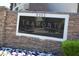 Elegant community signage with stone accents and landscaping at 9303 Gilcrease Ave # 1097, Las Vegas, NV 89149