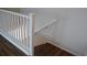 Close up of white stairway banister and wainscoting on upper landing at 9303 Gilcrease Ave # 1097, Las Vegas, NV 89149