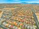 Wide aerial neighborhood shot showing landscape, nearby streets and community with houses nearby at 9768 Fox Estate St, Las Vegas, NV 89141