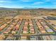 Overhead shot displays a meticulously planned community with neatly arranged houses in a symmetrical pattern and desert backdrop at 9768 Fox Estate St, Las Vegas, NV 89141