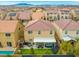 Aerial view of the property showcasing the backyard with patio, hot tub, and nearby mountain views at 9768 Fox Estate St, Las Vegas, NV 89141