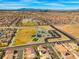 Scenic aerial view of a community park, complete with playground, parking, and green spaces, surrounded by residential homes at 9768 Fox Estate St, Las Vegas, NV 89141