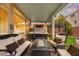 Relaxing covered back patio with a hot tub and comfortable seating, perfect for outdoor enjoyment at 9768 Fox Estate St, Las Vegas, NV 89141
