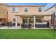 Lovely backyard featuring a patio, hot tub, and built-in grill with dining area, great for entertaining at 9768 Fox Estate St, Las Vegas, NV 89141