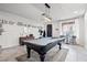 Stylish game room with a pool table, modern lighting, and elegant decor for entertainment at 9768 Fox Estate St, Las Vegas, NV 89141