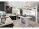 Modern kitchen features stainless steel appliances, granite countertops, and an island at 9768 Fox Estate St, Las Vegas, NV 89141
