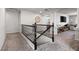 Carpeted staircase with decorative railing leading to an upstairs open space at 9768 Fox Estate St, Las Vegas, NV 89141