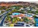 Stunning aerial view of community clubhouse, pools, and surrounding landscape at 10 Sugarberry Ln, Las Vegas, NV 89135