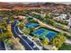 Aerial view of community tennis courts and landscape at 10 Sugarberry Ln, Las Vegas, NV 89135