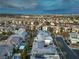 Wide aerial view of a new residential community, showcasing modern homes with pools and well-kept streets at 10 Sugarberry Ln, Las Vegas, NV 89135