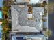 Overhead shot of modern tile roof and a swimming pool, situated between modern homes and trees at 10 Sugarberry Ln, Las Vegas, NV 89135
