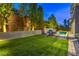 Inviting backyard with pool, spa, lounge chairs, and tranquil water feature at 10 Sugarberry Ln, Las Vegas, NV 89135