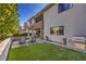 The backyard features a pool, artificial grass, and an outdoor grill area, perfect for entertaining at 10 Sugarberry Ln, Las Vegas, NV 89135