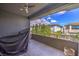 Balcony with black metal railings and views to neighboring homes and beautiful trees at 10 Sugarberry Ln, Las Vegas, NV 89135