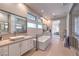 Bright bathroom featuring dual sinks, a soaking tub, walk-in shower, and recessed lighting at 10 Sugarberry Ln, Las Vegas, NV 89135