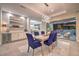 Stylish dining room with modern light fixture, dining table, and seamless access to the outdoor oasis at 10 Sugarberry Ln, Las Vegas, NV 89135
