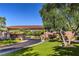 Guarded entrance to the community with lush landscaping at 10 Sugarberry Ln, Las Vegas, NV 89135