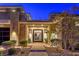 Inviting front entrance with a brick walkway, manicured landscaping, and a modern black front door at 10 Sugarberry Ln, Las Vegas, NV 89135