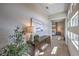 Hallway featuring a decorative chest and leading into a bedroom with natural light and cozy decor at 10 Sugarberry Ln, Las Vegas, NV 89135