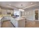 Bright kitchen features stainless steel appliances, a cooktop island, pantry and access to a dining area at 10 Sugarberry Ln, Las Vegas, NV 89135