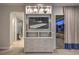 Living room TV console and shelving with access to the home's private balcony at 10 Sugarberry Ln, Las Vegas, NV 89135