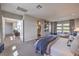 Spacious main bedroom with sitting area and ensuite bathroom access provides comfort and functionality at 10 Sugarberry Ln, Las Vegas, NV 89135