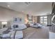 Spacious main bedroom with sitting area, plush rug, and abundant natural light at 10 Sugarberry Ln, Las Vegas, NV 89135
