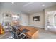 Office area showcases a large wood desk, neutral walls, carpeted floors, and a glimpse of the adjacent bathroom at 10 Sugarberry Ln, Las Vegas, NV 89135