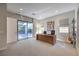 Bright office space with modern desk, shelving, and natural light with access to outdoor patio at 10 Sugarberry Ln, Las Vegas, NV 89135