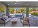 Outdoor living space features comfortable seating, a water feature, and views of the backyard at 10 Sugarberry Ln, Las Vegas, NV 89135