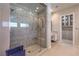 Modern bathroom with luxurious glass enclosed shower and custom tile work, plus vanity at 10 Sugarberry Ln, Las Vegas, NV 89135