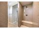 Modern shower features stylish hexagon tiles and a built-in bench for added comfort and convenience at 10 Sugarberry Ln, Las Vegas, NV 89135