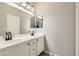 Bathroom featuring dual vanity sinks and bright lighting at 1010 Christopher View Ave, North Las Vegas, NV 89032