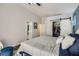 Spacious bedroom with sliding closet door and ensuite bathroom at 1010 Christopher View Ave, North Las Vegas, NV 89032