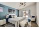 Bedroom with stylish decor, sitting area and outside view at 1010 Christopher View Ave, North Las Vegas, NV 89032