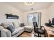 Comfortable home office features a sofa, desk, and natural light at 1010 Christopher View Ave, North Las Vegas, NV 89032
