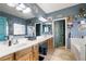 Bathroom featuring a large vanity, double sinks, and custom decor at 1131 S Blagg Rd, Pahrump, NV 89048